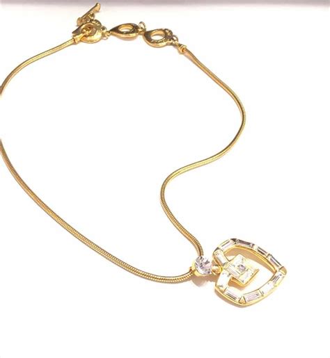 ysl diamond pendant